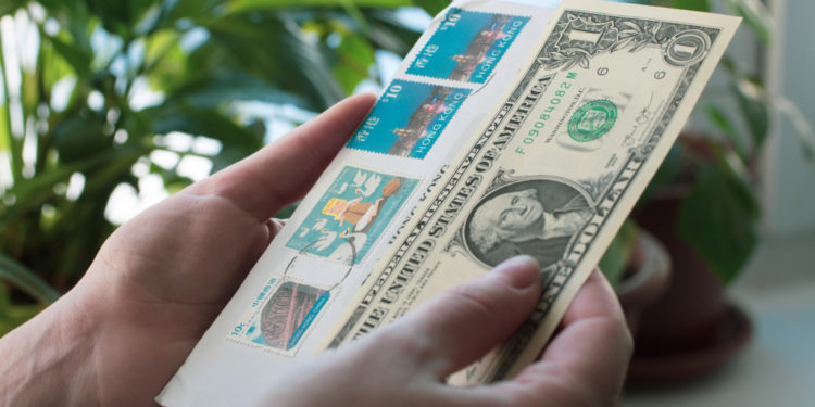 Is it possible to attach money to a letter instead of a stamp, and get it delivered?